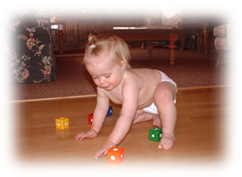Baby playing on radiant heated hardwood floor.