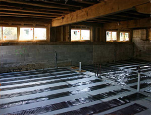 Electric floor heating system being installed.