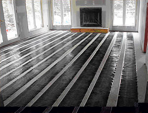 FloorHeat being installed for radiant floor heating system.
